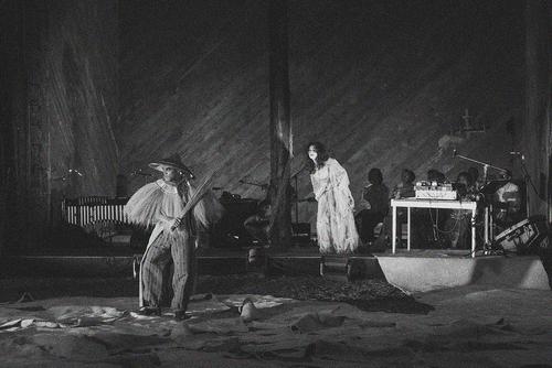 A black and white still from APOLAKI: Opera of the Scorched Earth