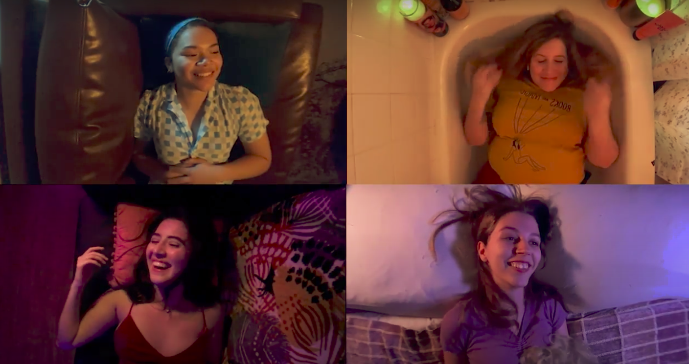 four actresses perform remotely, all smiling and lying down on different pieces of furniture in their separate apartments