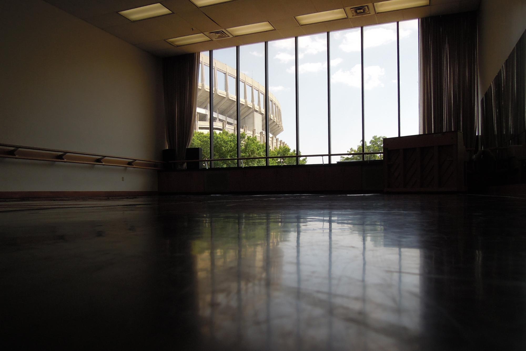 dance studio with large windows facing the UT football stadium