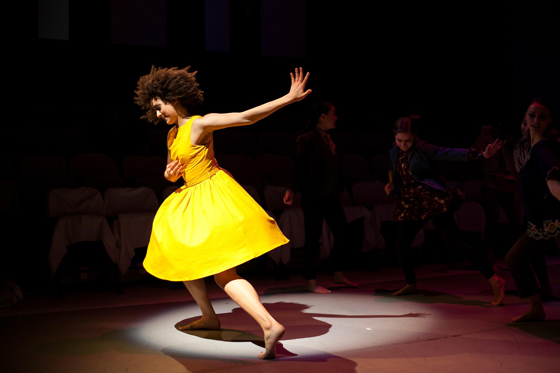 woman in yellow dress dancing 