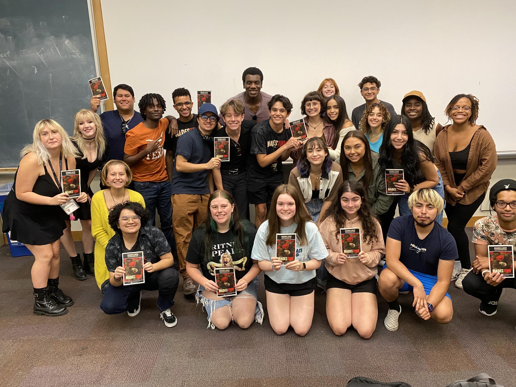 Theatre and Dance students pose with playbills from HADESTOWN