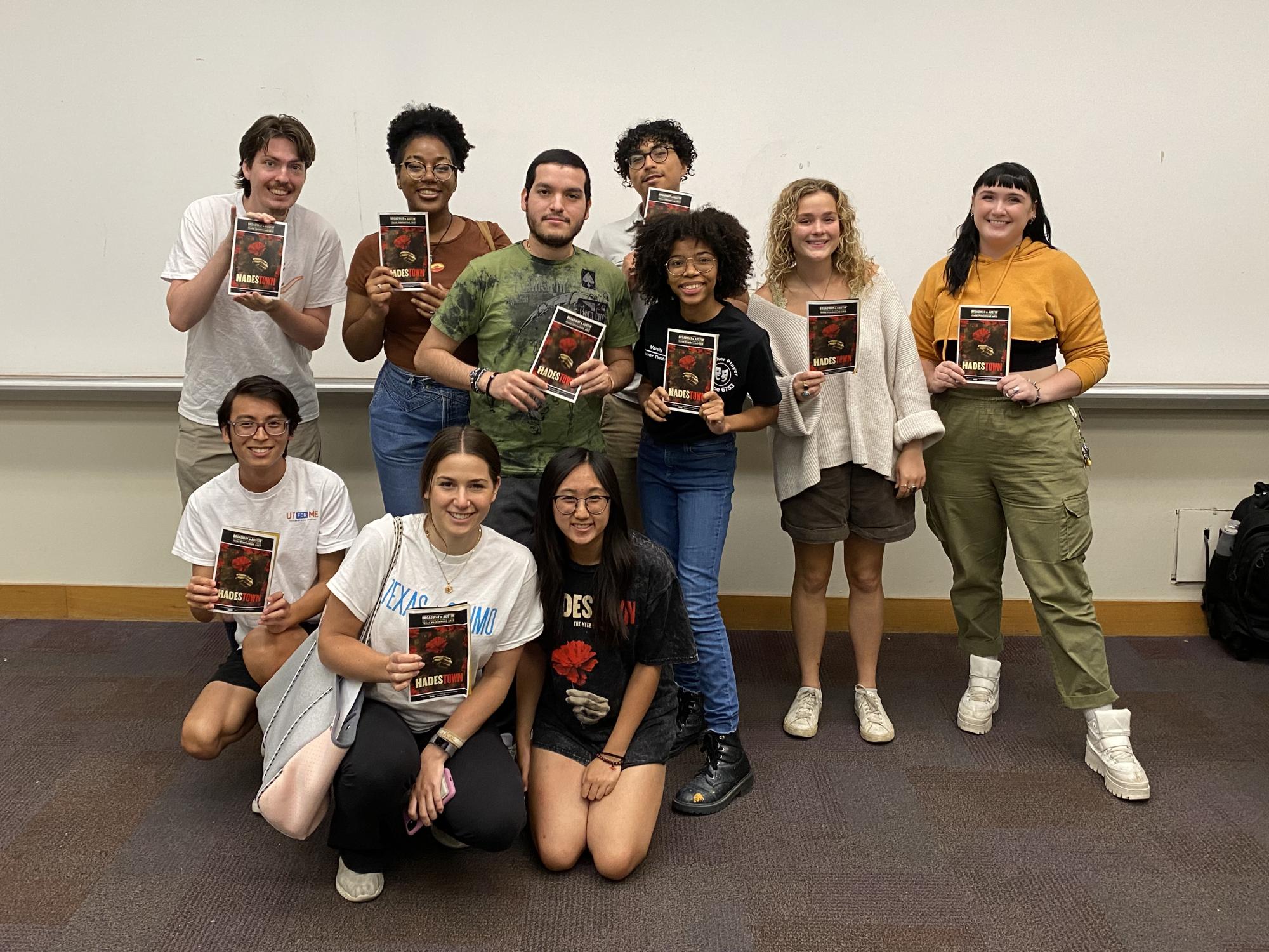 Theatre and Dance students pose with playbills from HADESTOWN