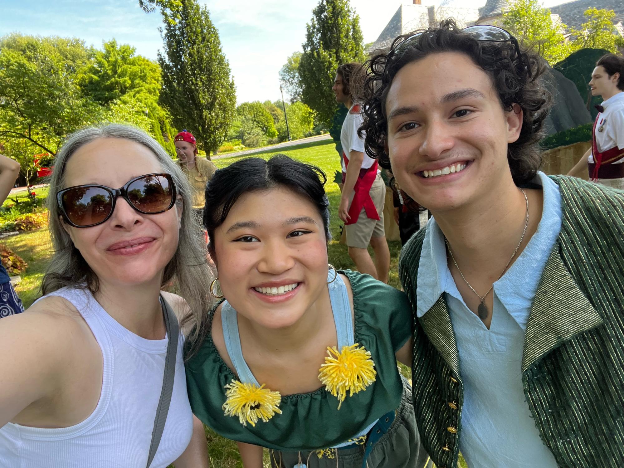 Quetta Carpenter takes a selfie with actors Mia Hsiung Nguyen and Dominic Gross after their outdoor performance