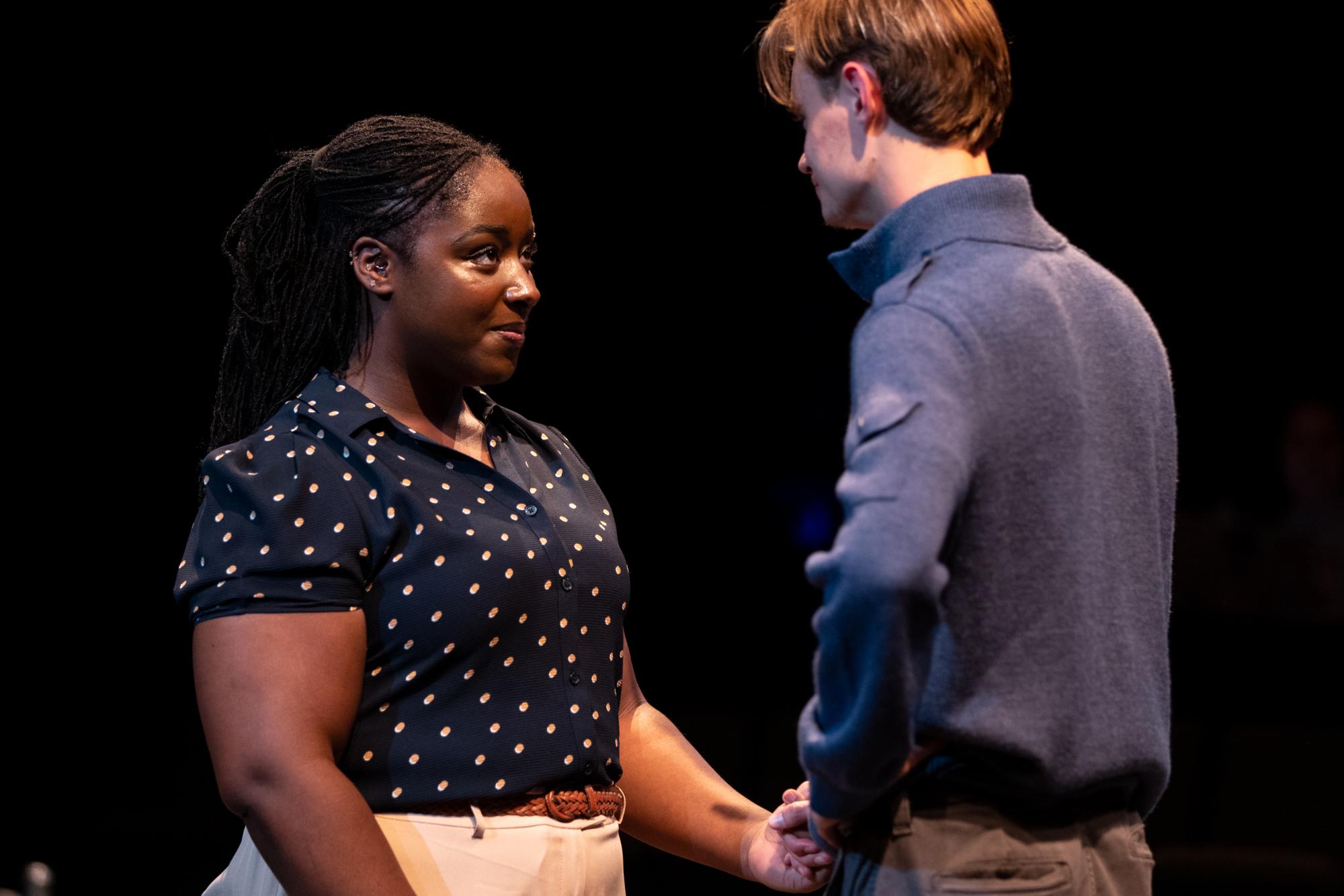 Shalom Onuorah as Jen and Oliver Aaro as Arthur share a sweet moment facing each other.