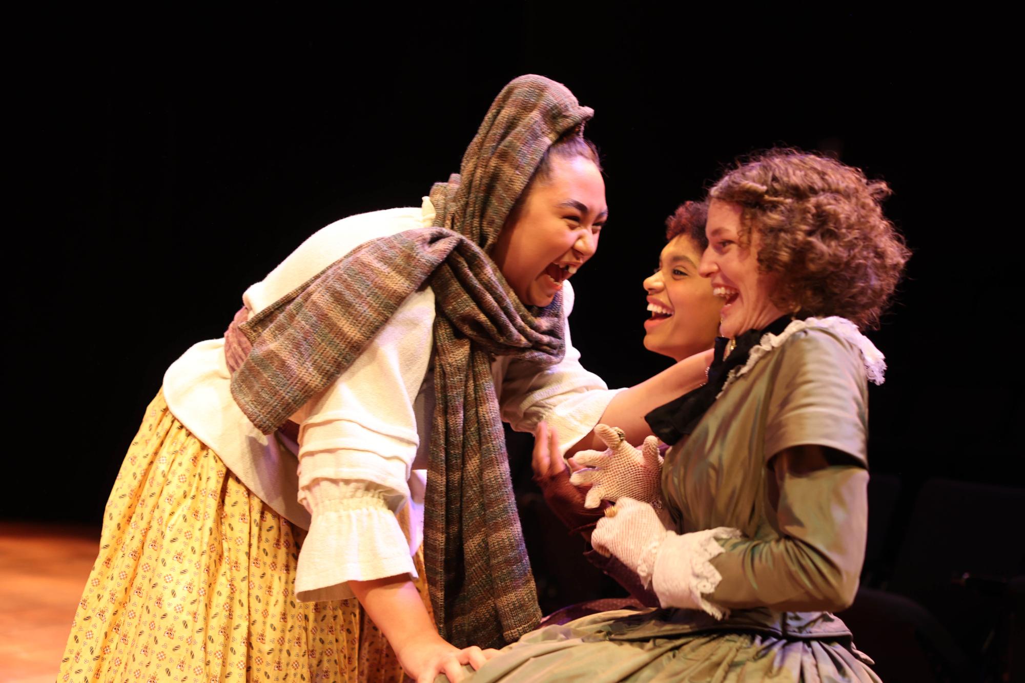 Juliet's nurse, Juliet and her mother sit sharing a laugh together.