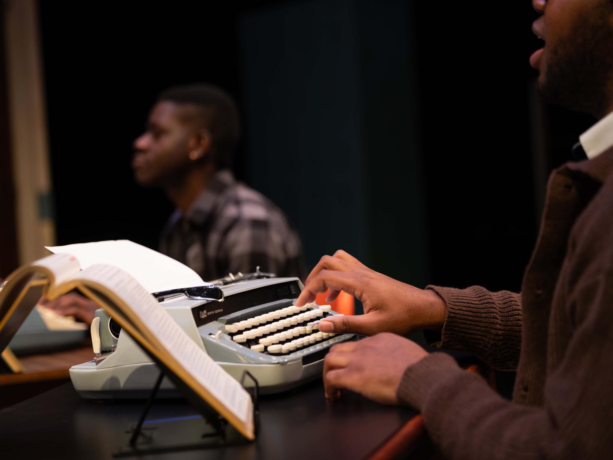 Typing takes work and Jay Smith as Donnie finds that out the hard way. This is a close up shot of Smith's hands.