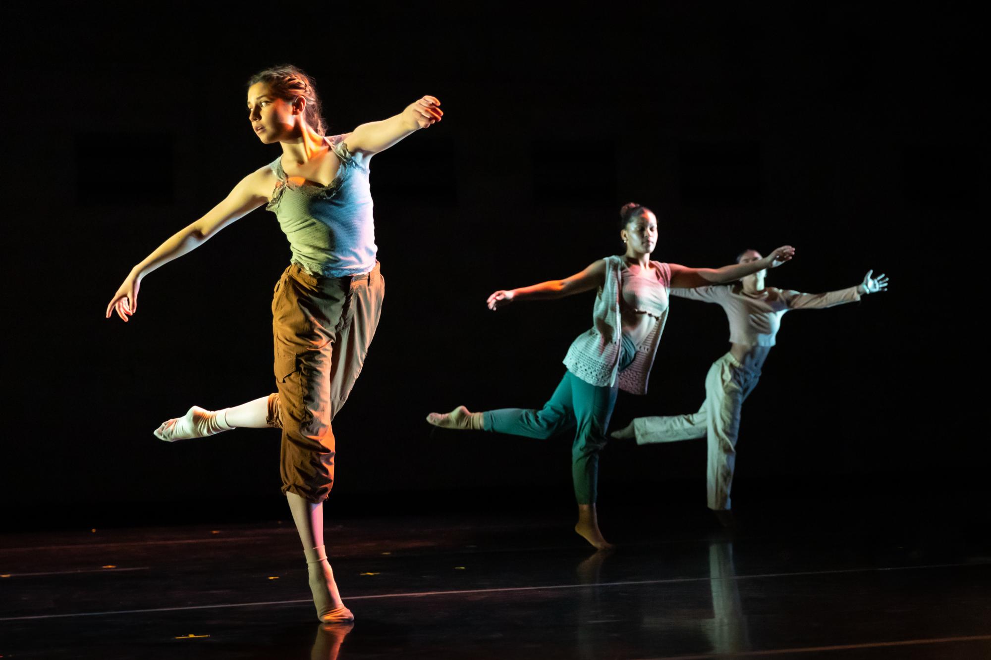 Dancers are posed in positions they take during the Live as ONE number.