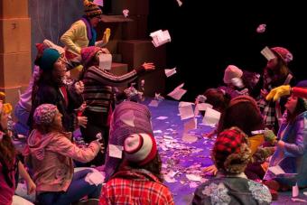 room full of people throwing papers