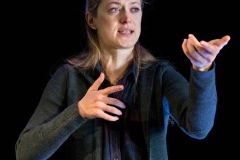 woman miming holding a gun 