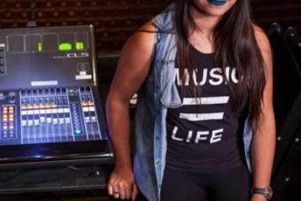 student sits on audio board panel 