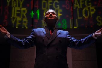 Jeffrey Skilling in front of stock ticker