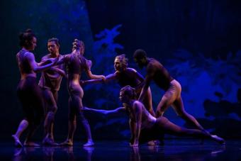 dancers in blue light