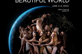 large group of ballet dancers gather around one lifted dancer, standing in front of a picture of the Earth