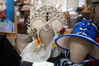 two hats displayed as part of a showcase.