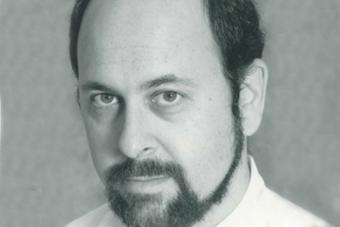 black and white headshot of David Mark Cohen