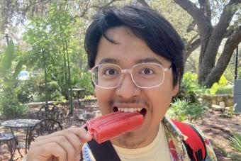 Edward Lopez-Jimenez eating a red popsicle