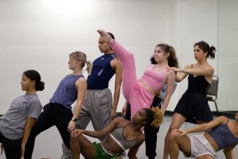 eight dancers rehearsing for choreographer Rebecca Carrillo's piece