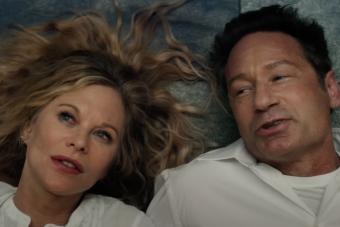 A still from WHAT HAPPENS LATER, feature actors Meg Ryan and David Duchovny laying on the ground, looking up
