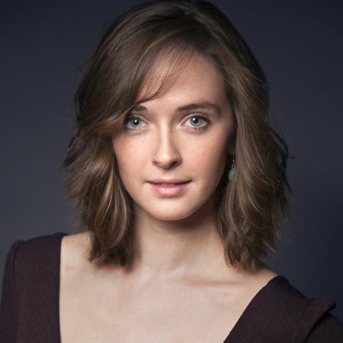 woman with short blonde hair and blue eyes