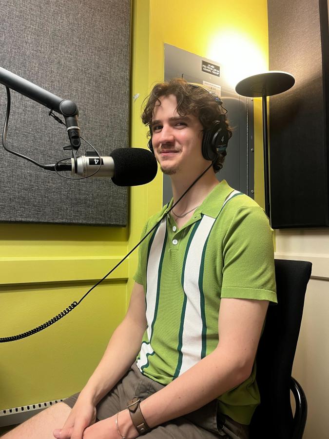 Eli Medenhall, a Theatre and Dance student, sits recording voiceover